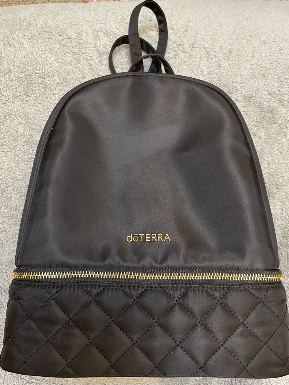 Doterra Black Quilted-Bottom Backpack with Gold Accents